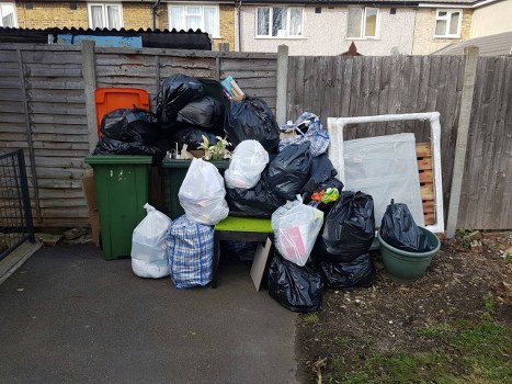 Business professionals managing waste in Newham office